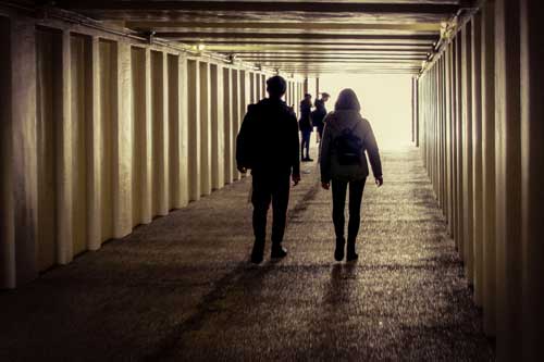 students-walking-urban-underpass